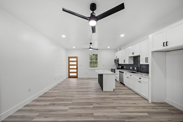8209 Richland St A/B, Unit A/B Houston, TX 77028 - kitchen with a ceiling fan, stainless steel appliances, a kitchen island, a sink, and recessed lighting