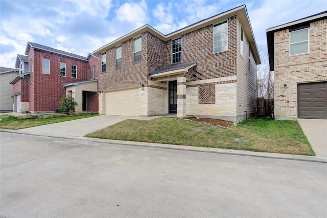 14514 Sanour Dr, Houston, TX 77084 - traditional home with driveway, a garage, brick siding, and a front yard