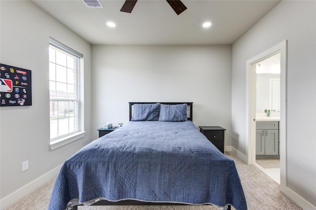 14514 Sanour Dr, Houston, TX 77084 - bedroom with multiple windows, carpet floors, connected bathroom, baseboards, and recessed lighting