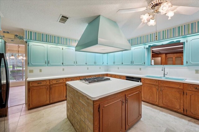 5210 Linda Ln, Beaumont, TX 77708 - kitchen featuring a sink, premium range hood, stainless steel gas cooktop, a ceiling fan, and light countertops