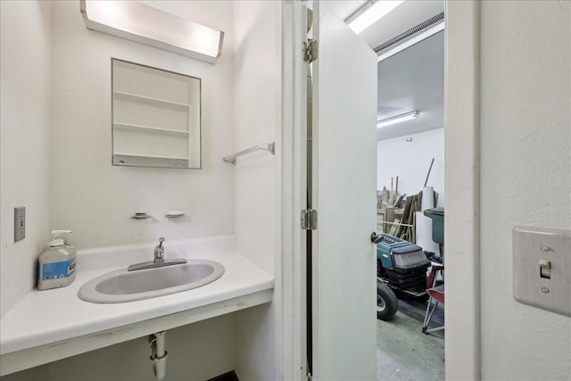 5210 Linda Ln, Beaumont, TX 77708 - bathroom featuring a sink and concrete floors