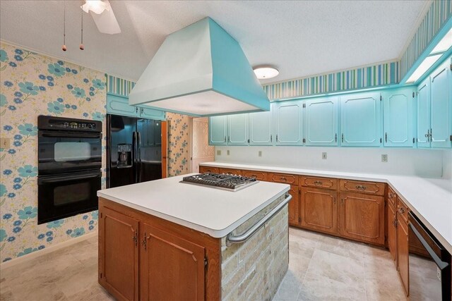 5210 Linda Ln, Beaumont, TX 77708 - kitchen featuring wallpapered walls, black appliances, island exhaust hood, a kitchen island, and a textured ceiling