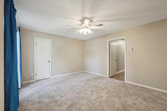 5210 Linda Ln, Beaumont, TX 77708 - carpeted spare room with a ceiling fan, baseboards, and a textured ceiling