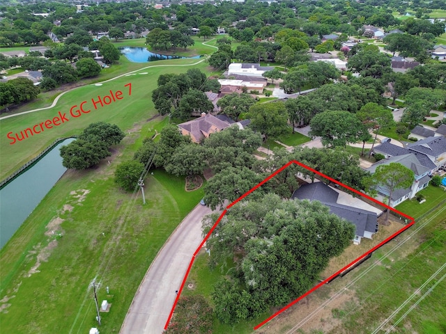 2702 Fairway Dr, Sugar Land, TX 77478 - aerial view of residential area with a large body of water, property parcel outlined, a golf course, and a tree filled landscape