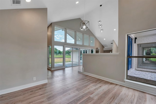 2702 Fairway Dr, Sugar Land, TX 77478 - unfurnished living room with high vaulted ceiling, wood finished floors, baseboards, and recessed lighting