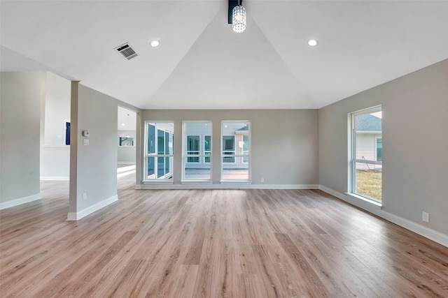 2702 Fairway Dr, Sugar Land, TX 77478 - unfurnished living room with vaulted ceiling, baseboards, and light wood-style floors