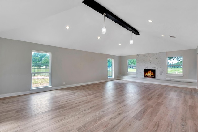 2702 Fairway Dr, Sugar Land, TX 77478 - unfurnished living room featuring beamed ceiling, light wood-style flooring, healthy amount of natural light, baseboards, and high vaulted ceiling