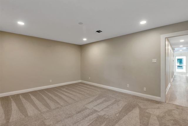 2702 Fairway Dr, Sugar Land, TX 77478 - spare room featuring light colored carpet, baseboards, and recessed lighting