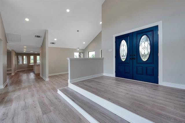2702 Fairway Dr, Sugar Land, TX 77478 - entrance foyer featuring healthy amount of natural light, light wood-style floors, baseboards, recessed lighting, and high vaulted ceiling