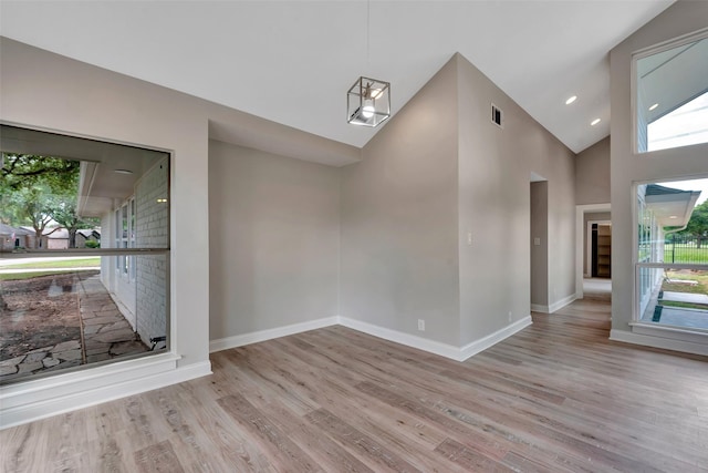 2702 Fairway Dr, Sugar Land, TX 77478 - unfurnished dining area featuring wood finished floors, baseboards, and high vaulted ceiling