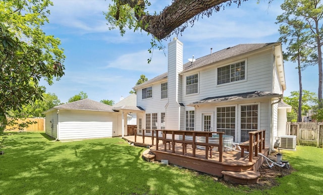 7930 Tizerton Ct, Spring, TX 77379 - back of property featuring a chimney, central AC unit, and a deck