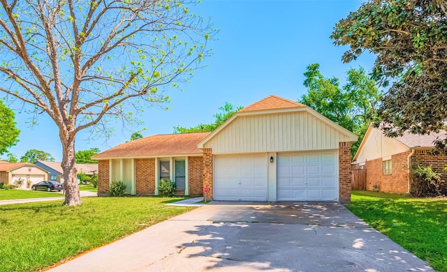 24226 Spring Towne Dr, Spring, TX 77373 - ranch-style house featuring driveway, a front yard, an attached garage, and brick siding