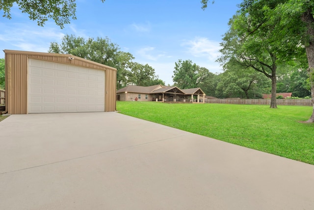 8518 Kerr Dr, Tomball, TX 77375 - view of front facade featuring a garage and an outdoor structure