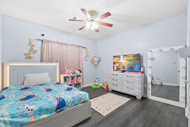 8518 Kerr Dr, Tomball, TX 77375 - bedroom with dark wood-style floors, baseboards, and ceiling fan