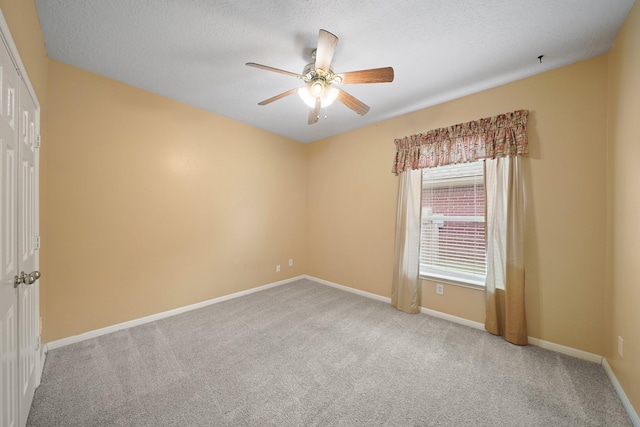 4903 Cedar Cove Dr, Baytown, TX 77521 - empty room featuring carpet, a ceiling fan, and baseboards