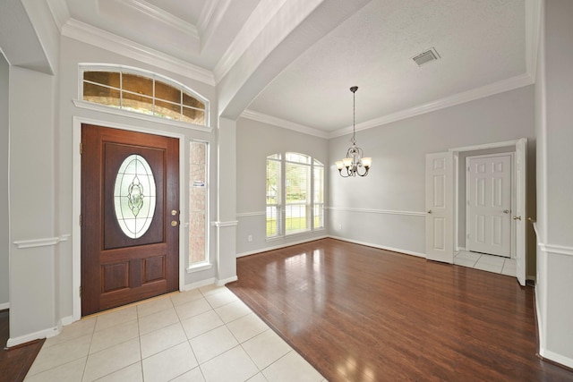 4903 Cedar Cove Dr, Baytown, TX 77521 - entrance foyer featuring a chandelier, light wood-type flooring, crown molding, and baseboards