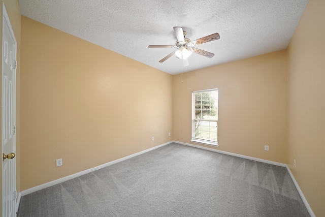 4903 Cedar Cove Dr, Baytown, TX 77521 - carpeted empty room with ceiling fan, a textured ceiling, and baseboards