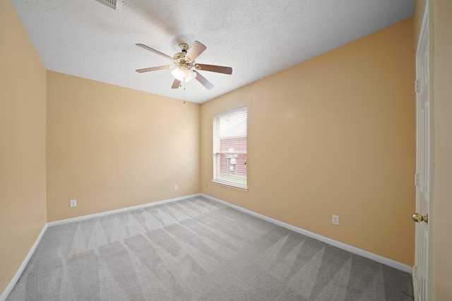 4903 Cedar Cove Dr, Baytown, TX 77521 - carpeted spare room featuring ceiling fan, baseboards, and a textured ceiling