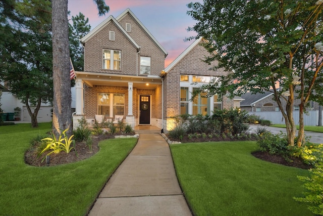 22 Hedgedale Way, Spring, TX 77389 - craftsman-style home featuring brick siding, a front lawn, and covered porch