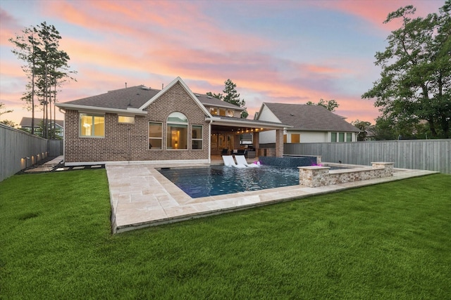 22 Hedgedale Way, Spring, TX 77389 - back of property with a fenced backyard, brick siding, a patio area, and roof with shingles
