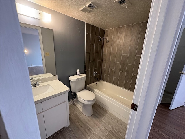 17230 Imperial Valley Dr Unit 24, Houston, TX 77060 - bathroom featuring a textured ceiling, vanity, and washtub / shower combination