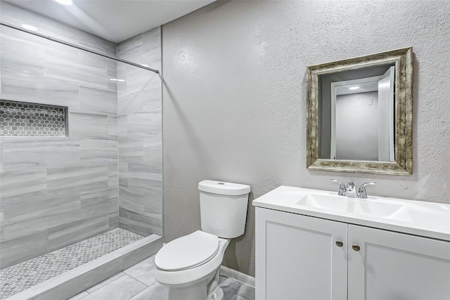 22910 Summer Green Ln, Spring, TX 77373 - bathroom with tiled shower, vanity, and a textured wall