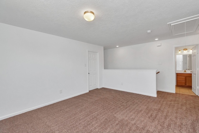 19003 Barnesdale Ct, Houston, TX 77073 - empty room featuring attic access, light colored carpet, a textured ceiling, baseboards, and recessed lighting