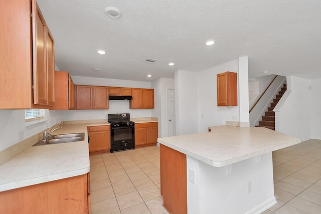 19003 Barnesdale Ct, Houston, TX 77073 - kitchen with gas stove, a sink, light tile patterned floors, a peninsula, and under cabinet range hood