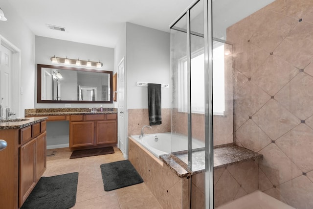 6411 St Placidia Dr, Spring, TX 77379 - bathroom featuring vanity, a stall shower, a bath, and tile patterned flooring