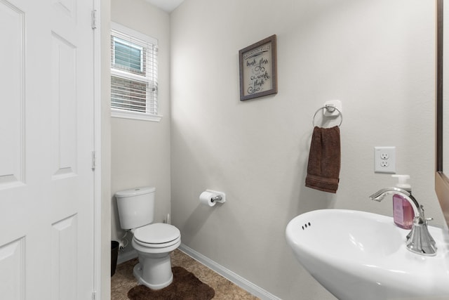 6411 St Placidia Dr, Spring, TX 77379 - bathroom with a sink, toilet, baseboards, and tile patterned flooring