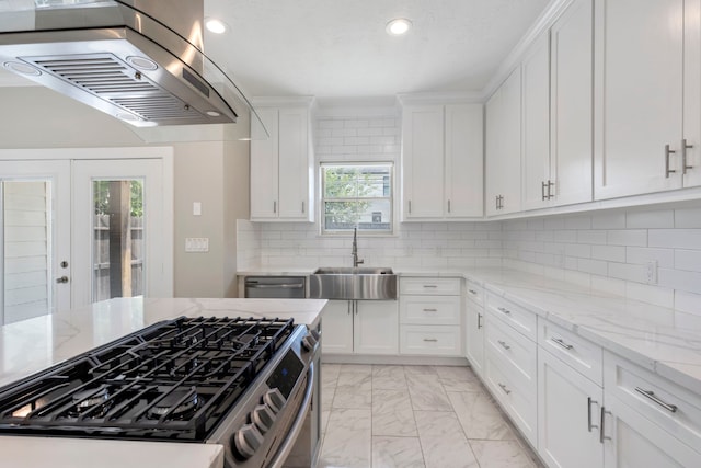 514 E 29th St, Houston, TX 77008 - kitchen featuring a sink, appliances with stainless steel finishes, wall chimney exhaust hood, light marble finish floors, and recessed lighting