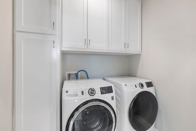 514 E 29th St, Houston, TX 77008 - laundry area with cabinet space and washing machine and dryer