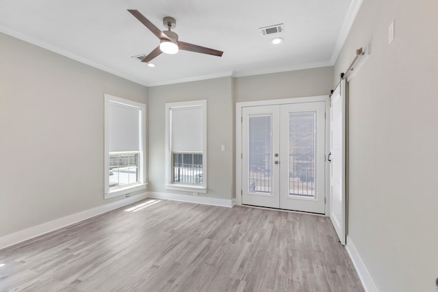 514 E 29th St, Houston, TX 77008 - spare room featuring light wood-style floors, crown molding, ceiling fan, french doors, and baseboards