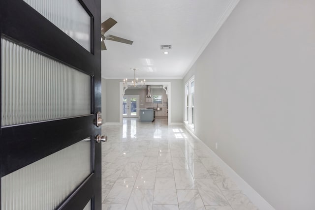 514 E 29th St, Houston, TX 77008 - corridor featuring ornamental molding, baseboards, a chandelier, french doors, and light marble finish floors