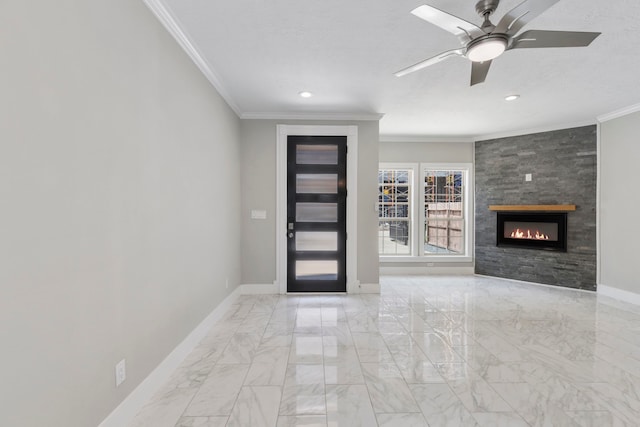 514 E 29th St, Houston, TX 77008 - entryway with crown molding, baseboards, marble finish flooring, ceiling fan, and a tile fireplace