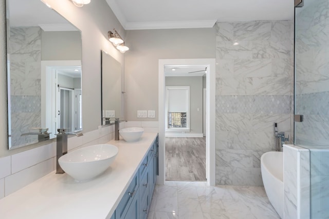 514 E 29th St, Houston, TX 77008 - full bath featuring marble finish flooring, a freestanding bath, double vanity, and ornamental molding