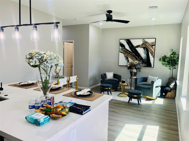 863 Dolly Wright St, Houston, TX 77088 - living room with wood finished floors, ceiling fan, baseboards, and recessed lighting