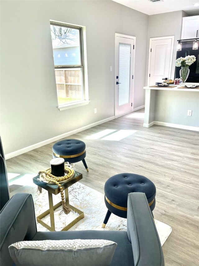 863 Dolly Wright St, Houston, TX 77088 - living room with baseboards and light wood-style flooring