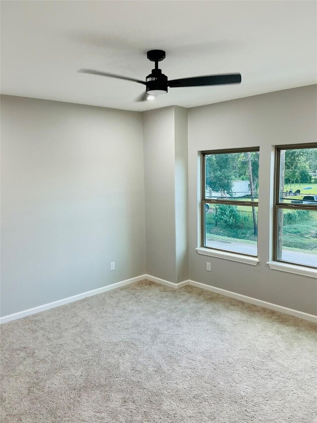 863 Dolly Wright St, Houston, TX 77088 - empty room with a ceiling fan, carpet, and baseboards