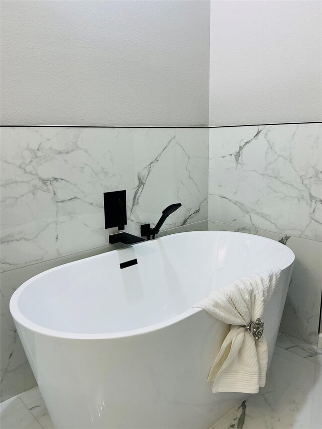 863 Dolly Wright St, Houston, TX 77088 - bathroom view of a soaking tub and tile walls