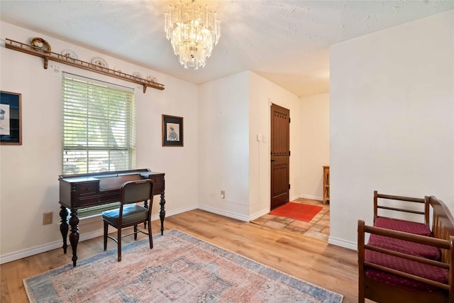 2602 Pilgrims Point Dr, Webster, TX 77598 - office space with light wood-type flooring, a chandelier, and baseboards