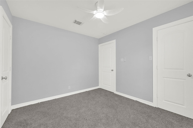 11423 Raincove Dr, Houston, TX 77016 - unfurnished bedroom with dark colored carpet, a ceiling fan, and baseboards