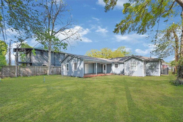 11423 Raincove Dr, Houston, TX 77016 - back of property featuring a wooden deck