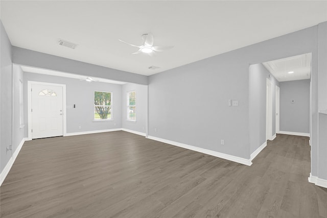 11423 Raincove Dr, Houston, TX 77016 - spare room with a ceiling fan, wood finished floors, and baseboards