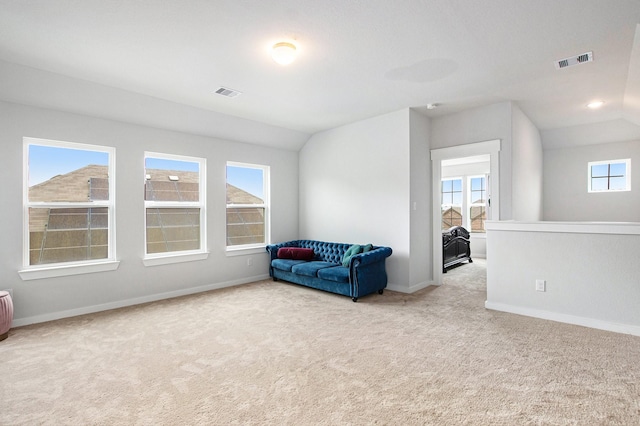 40557 Mostyn Lake Dr, Magnolia, TX 77354 - living area featuring carpet, baseboards, and lofted ceiling