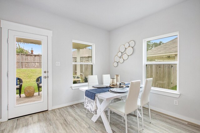 40557 Mostyn Lake Dr, Magnolia, TX 77354 - dining room with wood finished floors and baseboards