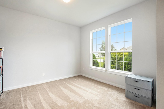 40557 Mostyn Lake Dr, Magnolia, TX 77354 - unfurnished bedroom featuring multiple windows, baseboards, and carpet flooring
