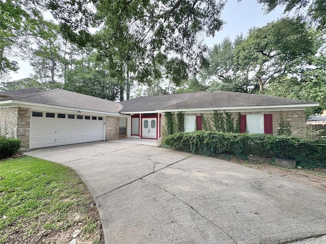 12803 Cloverwood Dr, Cypress, TX 77429 - single story home with a garage, concrete driveway, and brick siding