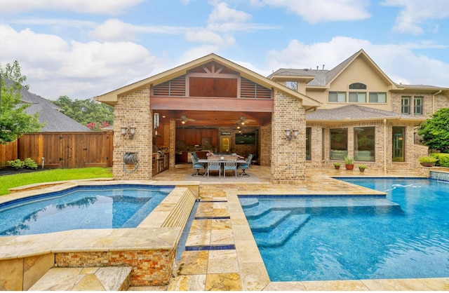 4503 Summits Edge Ln, Katy, TX 77494 - rear view of property featuring brick siding, a patio, a ceiling fan, and an outdoor hot tub