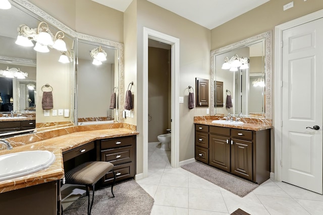 4503 Summits Edge Ln, Katy, TX 77494 - bathroom with two vanities, tile patterned floors, and a bidet